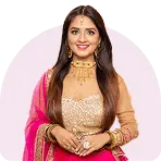 Traditional ethnic wear displayed on mannequins with intricate patterns and vibrant colors, placed in a well-lit boutique, creating a festive and elegant mood