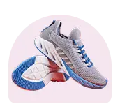 Variety of footwear such as sneakers and sandals displayed on shelves in a stylish store, suggesting comfort and fashion in a lively environment